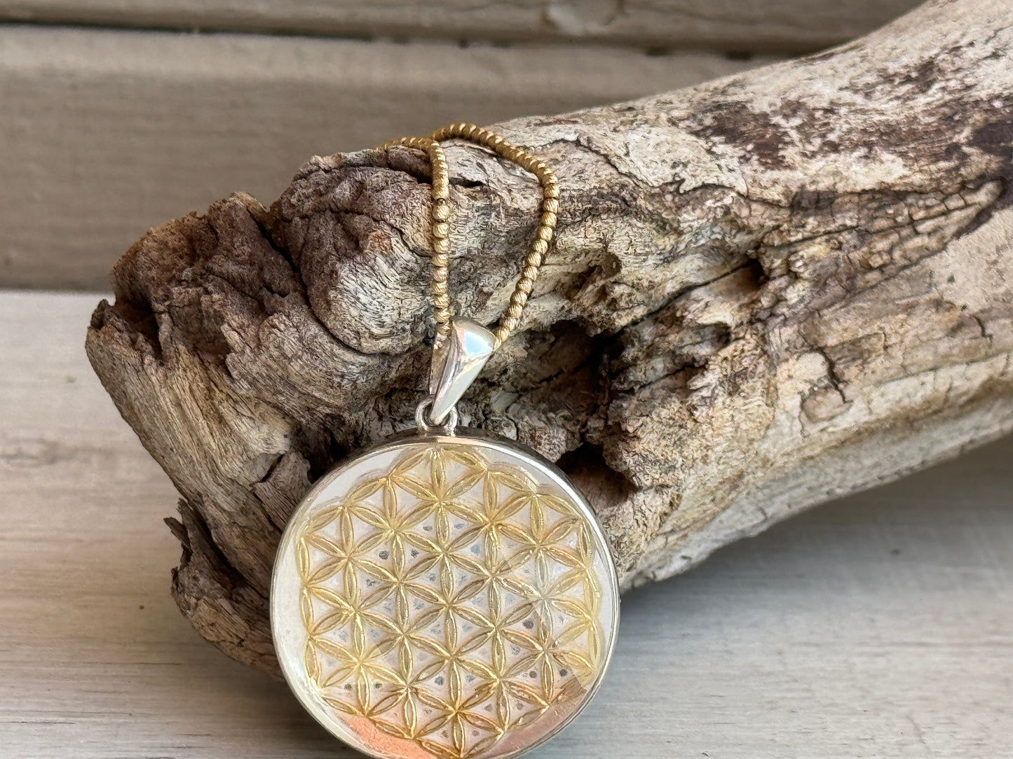 Golden Flower of Life Charm with High-Frequency Cut Quartz