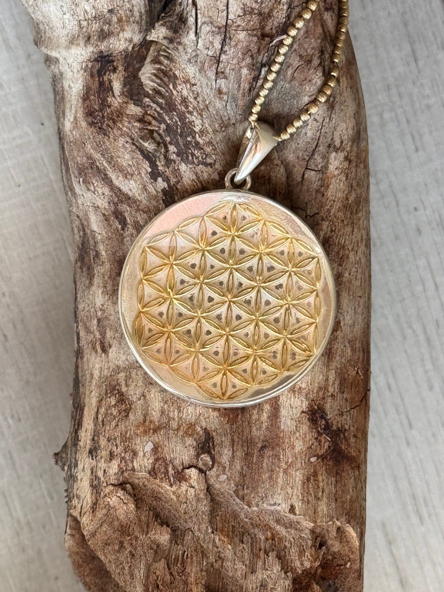 Golden Flower of Life Charm with High-Frequency Cut Quartz